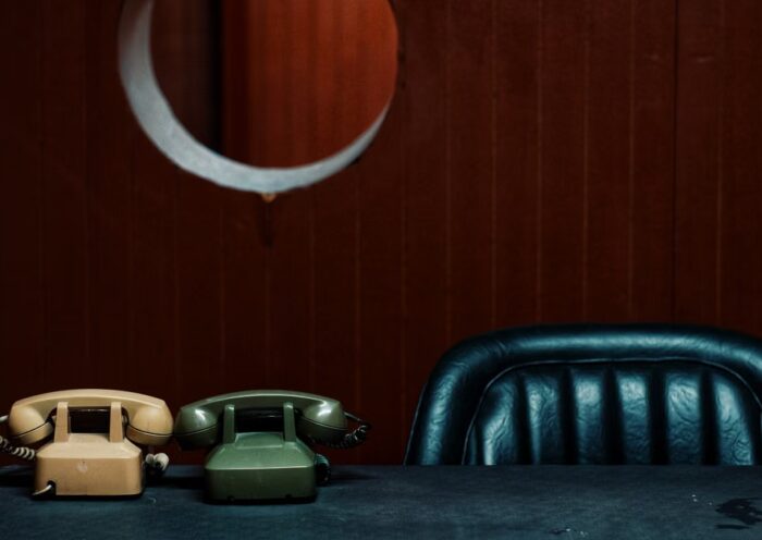 Vintage telephones on a desk in a classic office