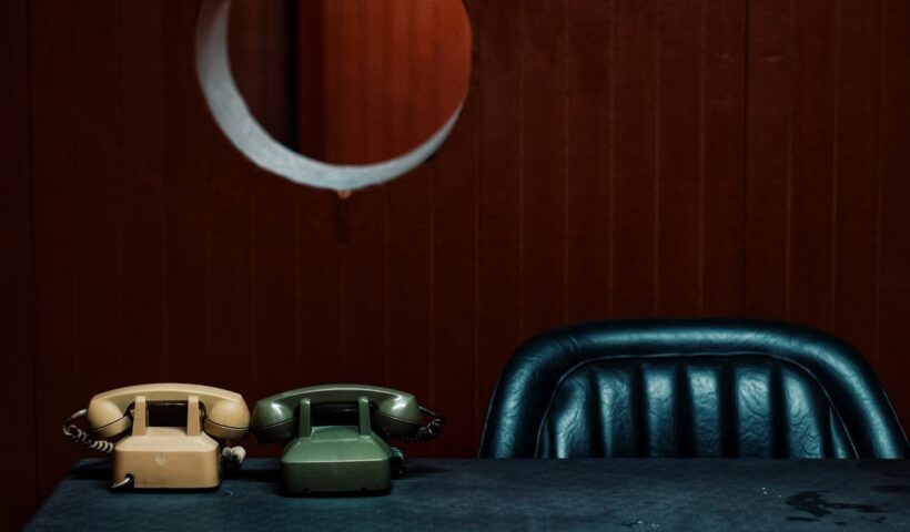 Vintage telephones on a desk in a classic office