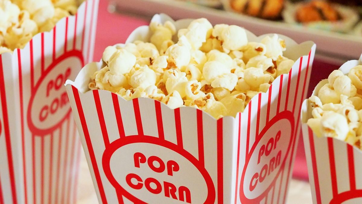 Close-up of gourmet popcorn in classic red and white striped boxes