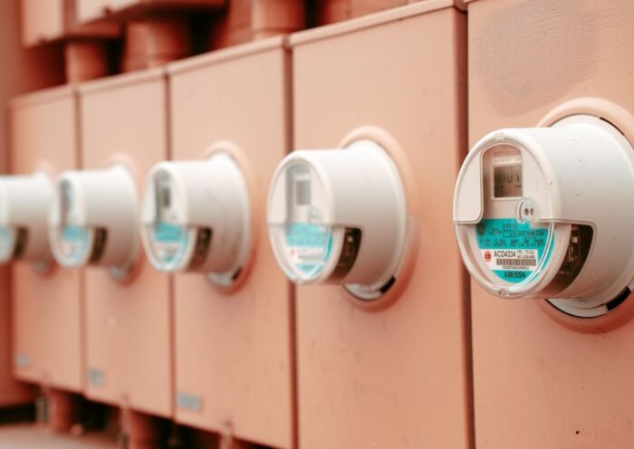 Close-up view of a row of industrial electricity meters for power monitoring and technology