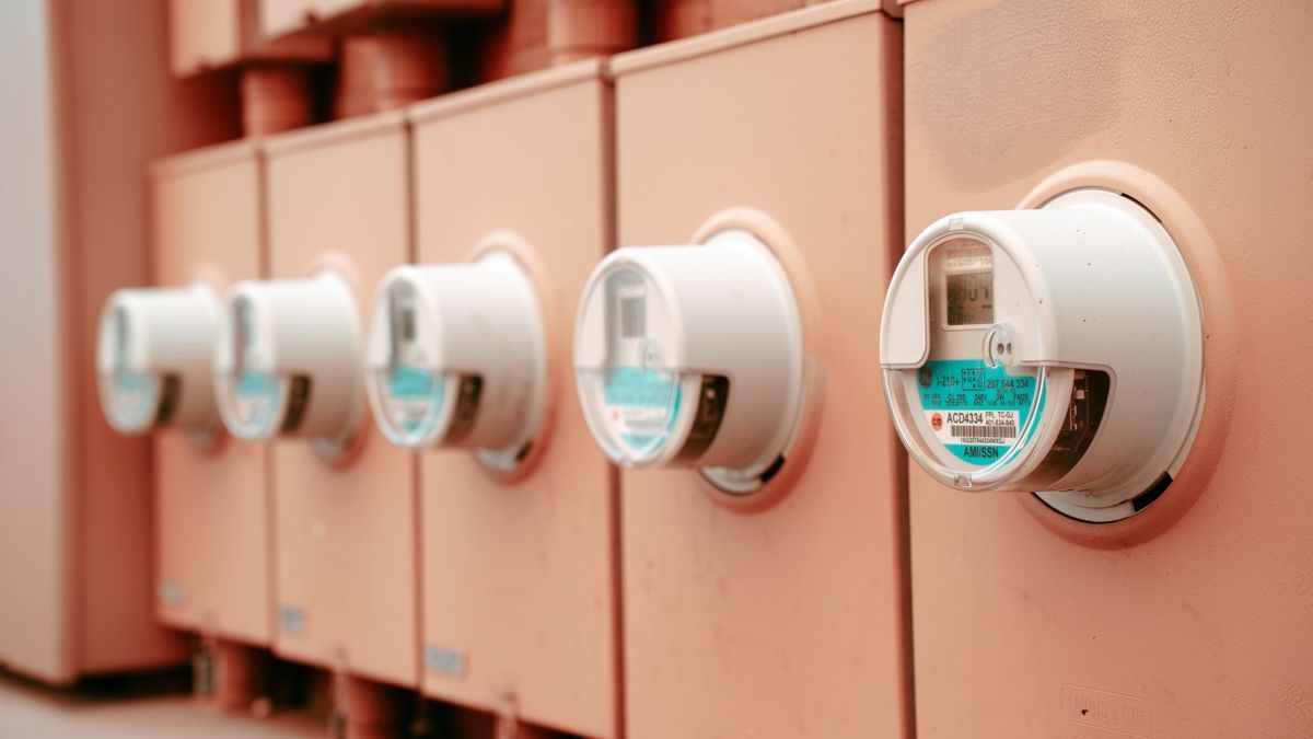 Close-up view of a row of industrial electricity meters for power monitoring and technology