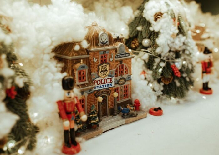 Miniature Christmas village with snow and nutcracker